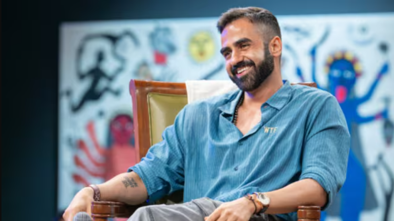 Nikhil Kamath sitting on chair in an interview